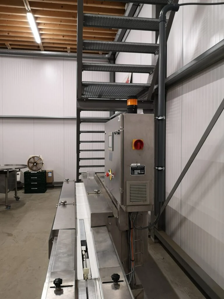 Conveyor with control cabinet and operator panel