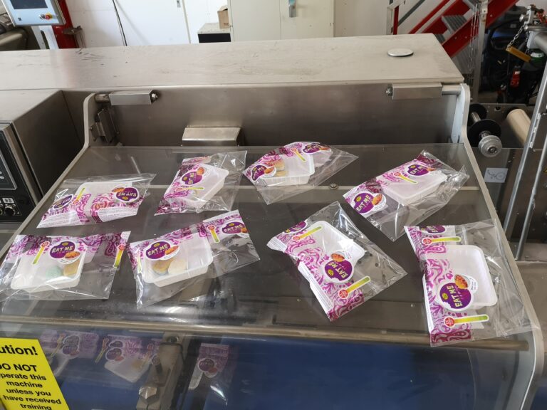 Wrapped trays after the flow wrapper